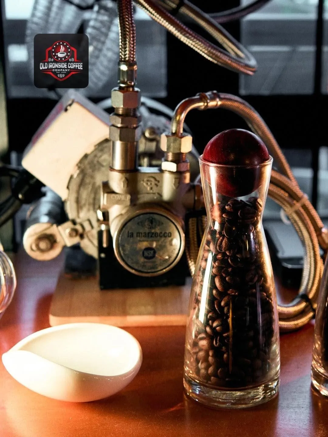 Coffee beans and vintage espresso craftsmanship at Old Ironside